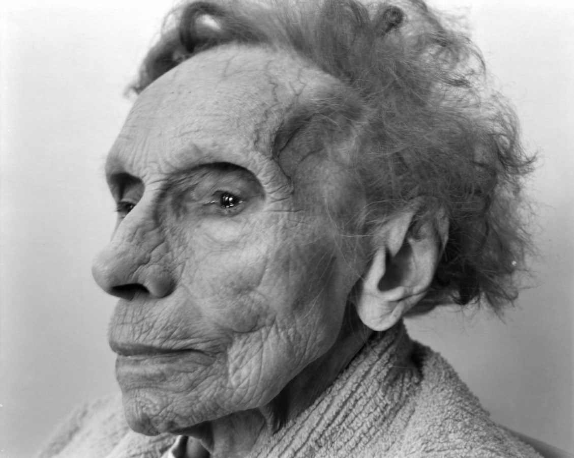 Black-and-white three-quarter photographic portrait of an elderly woman