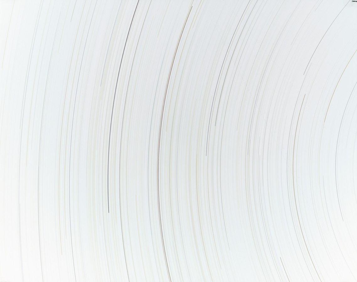 Inverted color photograph of curved black lines on a white background