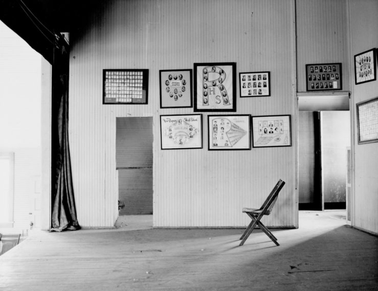 Pictures of graduating classes, on a stage at the end
of a gymnasium in a consolidated school (closed),
New Raymer, Weld County, Colorado, 1970, gelatin-silver print