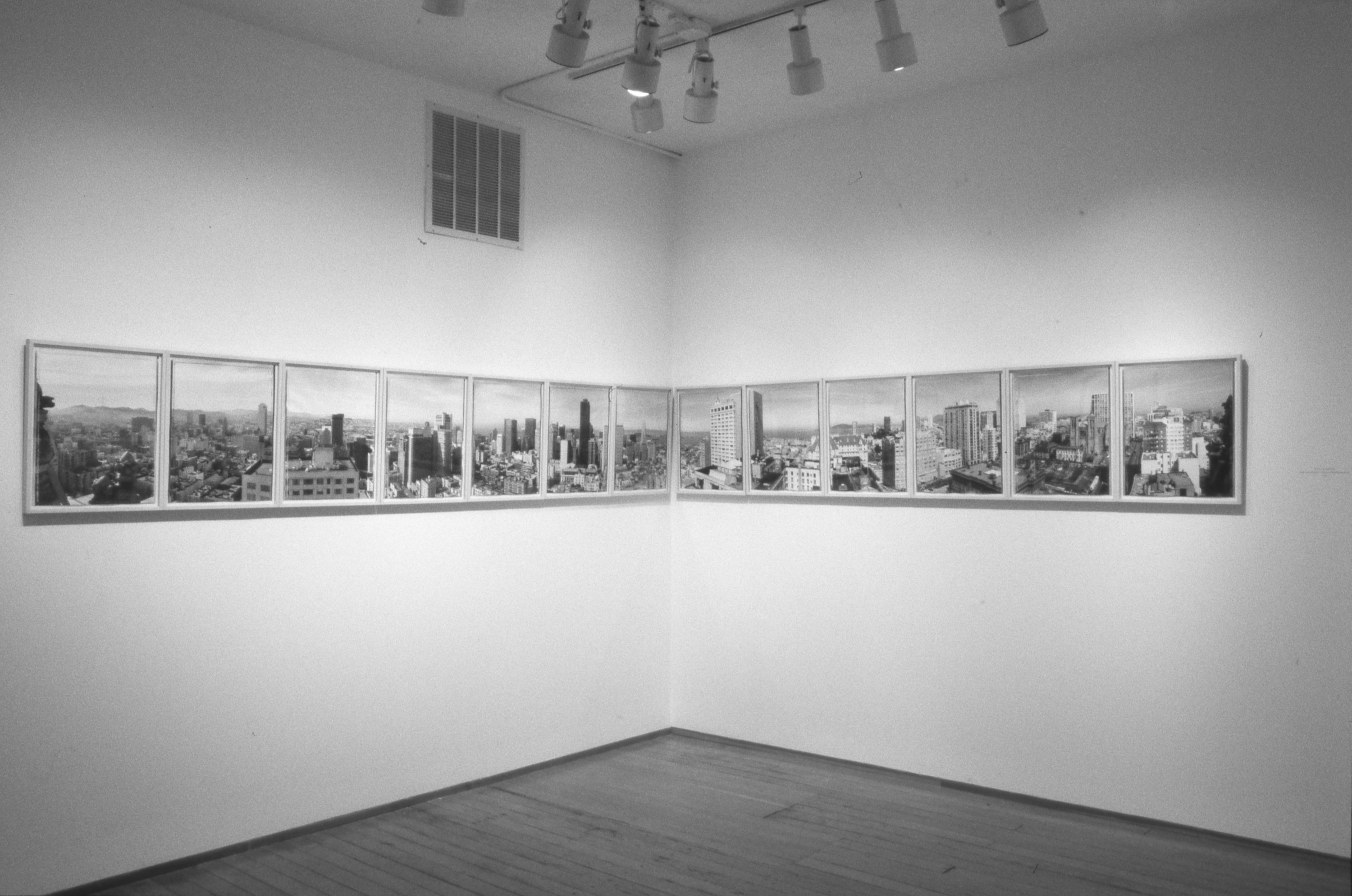 Installation photograph of framed prints on gallery walls