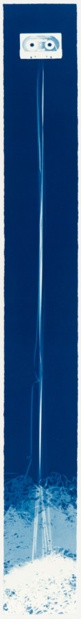 Vertical image of a white cassette at the top with its tape trailing to the bottom into a white blotch on a deep blue background