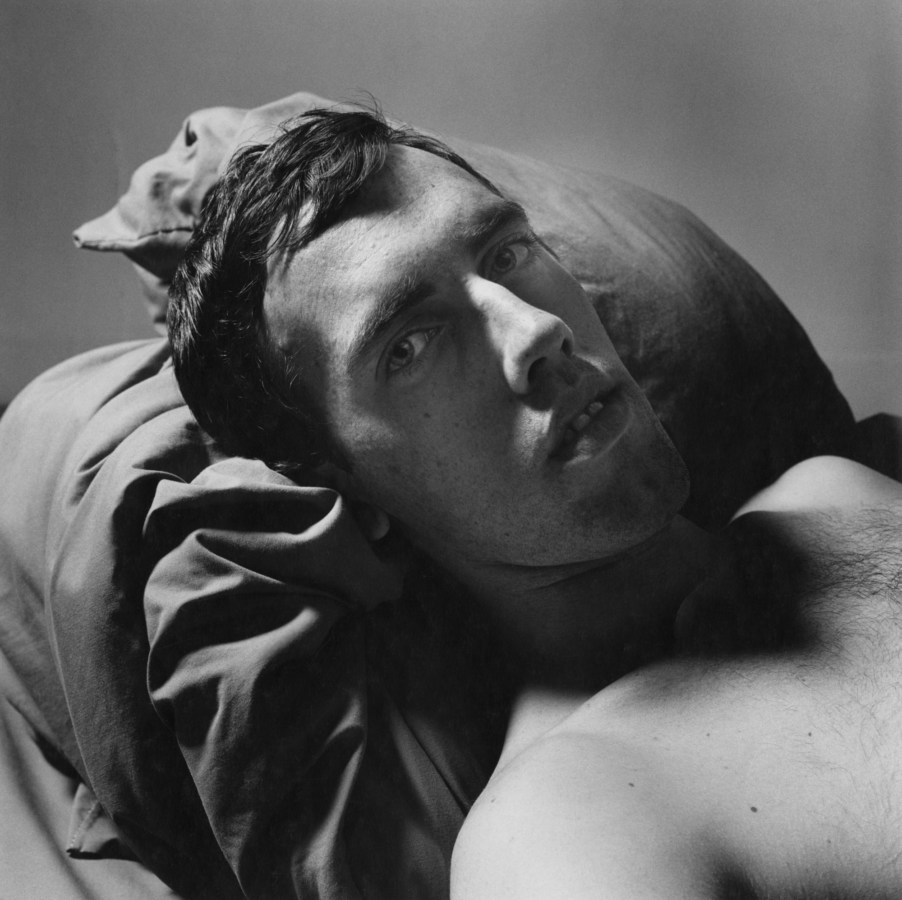 Black and white photograph of man reclining