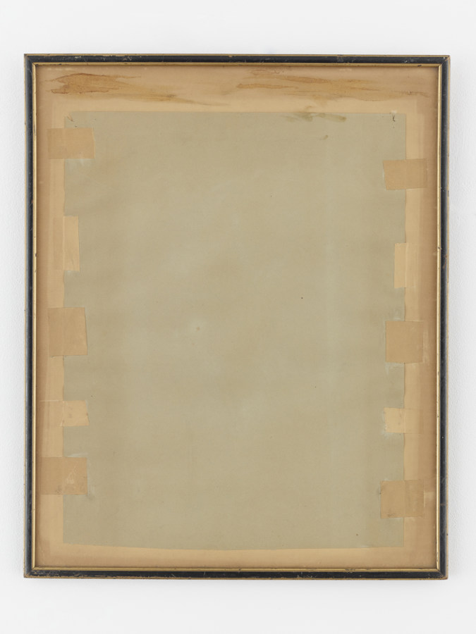 Color image of a black and gold distressed framed depicting a greenish sheet taped down by brown tape