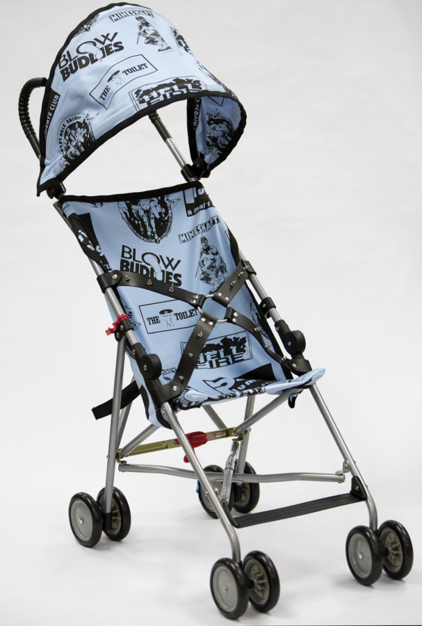 Color image of a blue child's stroller adorned with gay bar logos and leather harness