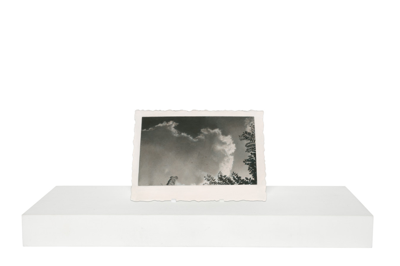 Painting of clouds and tips of tree branches on a wooden stand