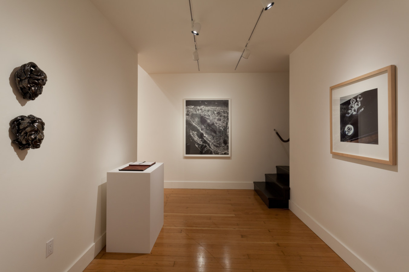 Installation photograph of a gallery space with prints on the wallls