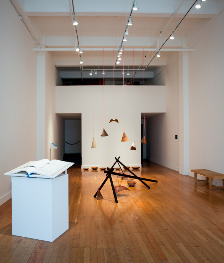 Color image of white walled gallery exhibiting sculptural sound artworks