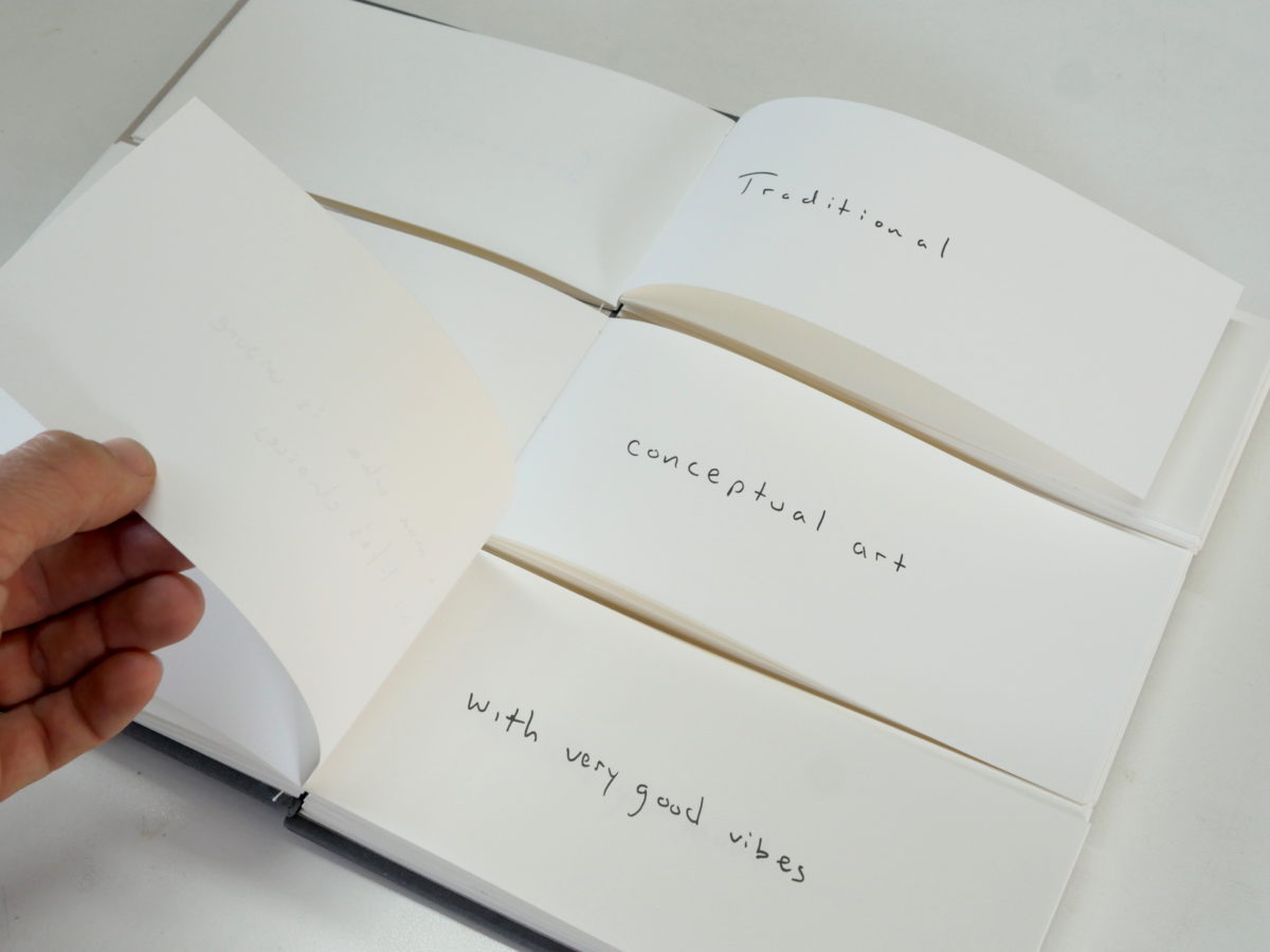 Color image of large book with three moveable components that create singular pages on white background