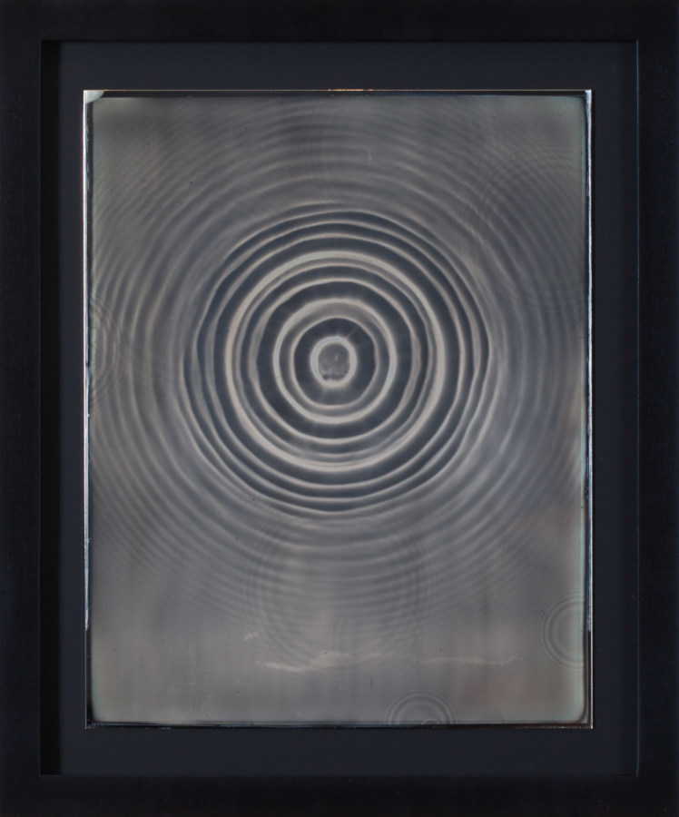 Color image of daguerreotype depicting singular water ripple