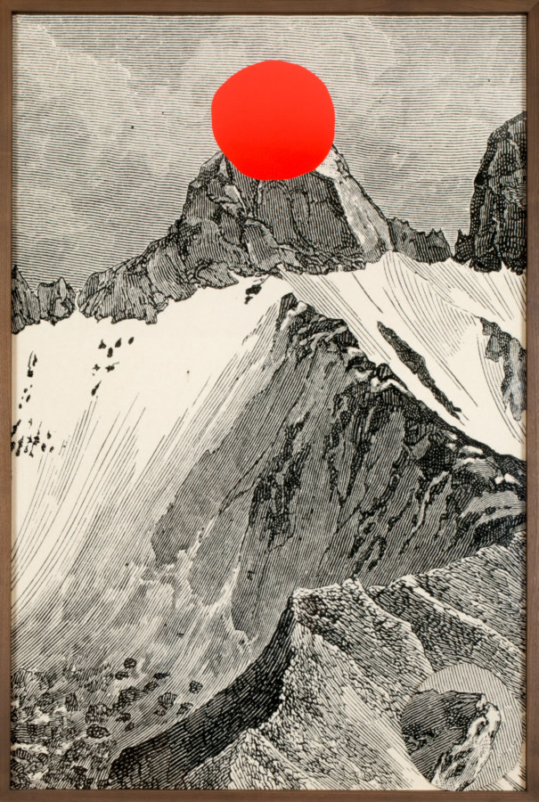 A framed etching of a mountain, the peak of which has been cut out and left in the bottom of the frame.