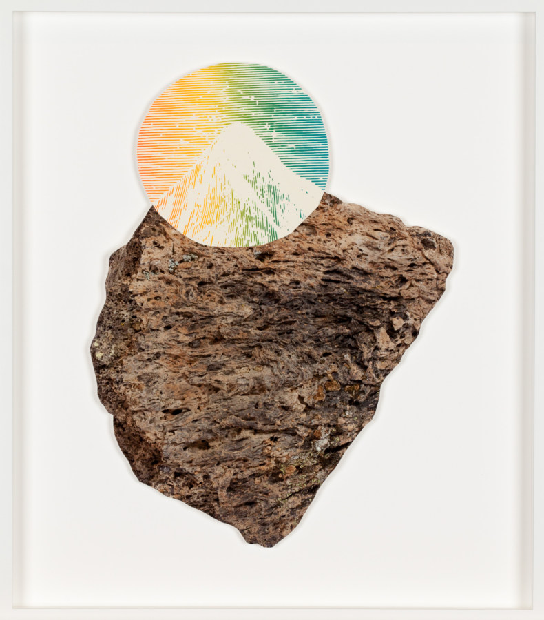 A color photograph of a rock with a multi-colored round print of a mountain peak collaged on top, so the lines of the rock and mountain align.