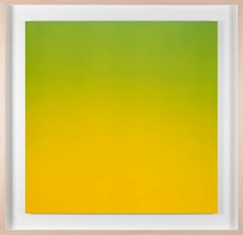 A framed photograph of a color field gradient going from green at the top to yellow at the bottom