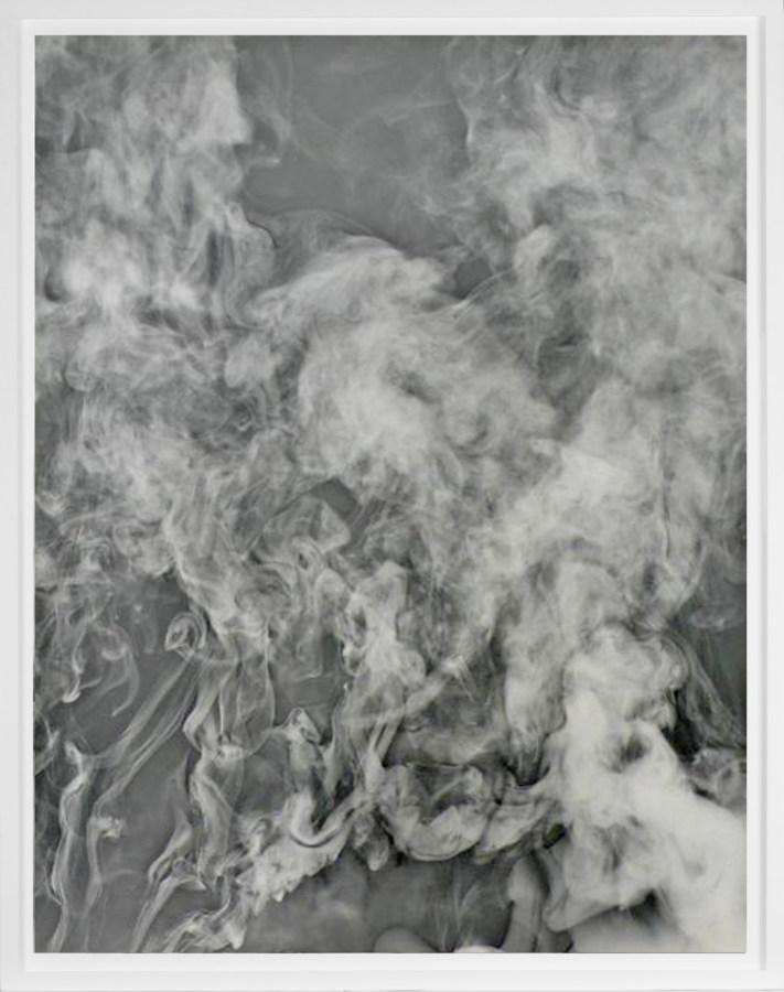 Black-and-white photogram of smoke rising against a grey background