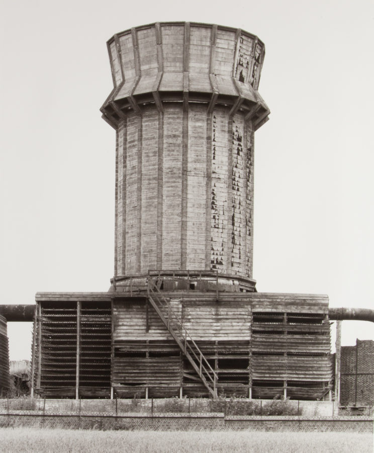 Black and white photograph of a cooling tower