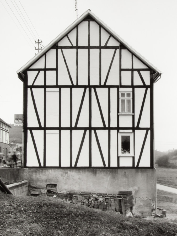 Black and white photograph of a house facade