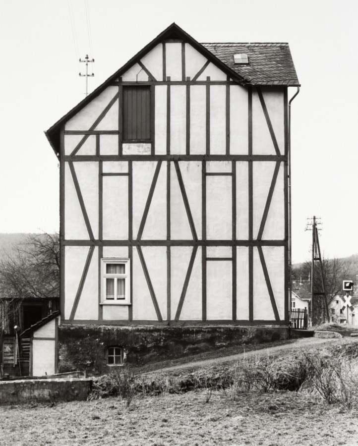 Black and white photograph of a house facade