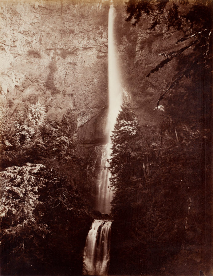 Ninteteenth century photograph of a waterfall down a cliff