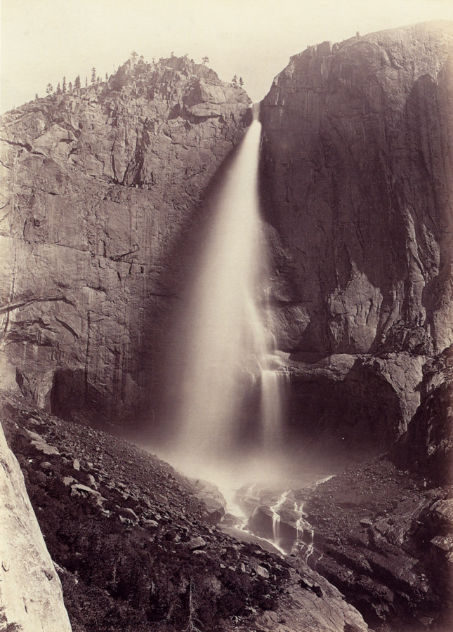 Ninteteenth century photograph of a waterfall between stone cliffsides