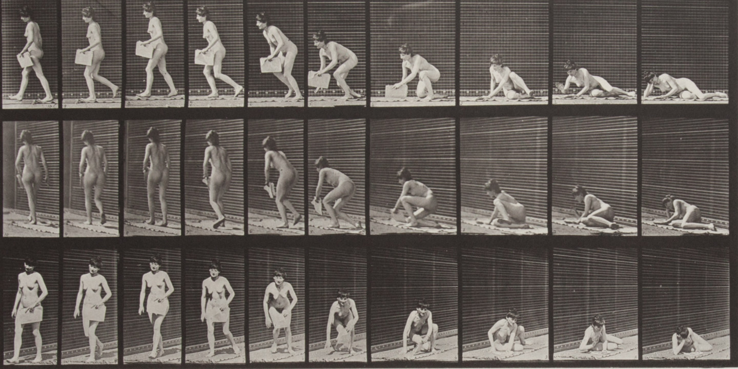 Sepia toned photograph with a grid of 30 panels showing a topless woman arising from the ground with a newspaper in her left hand; atypically, the sequence reads right to left.