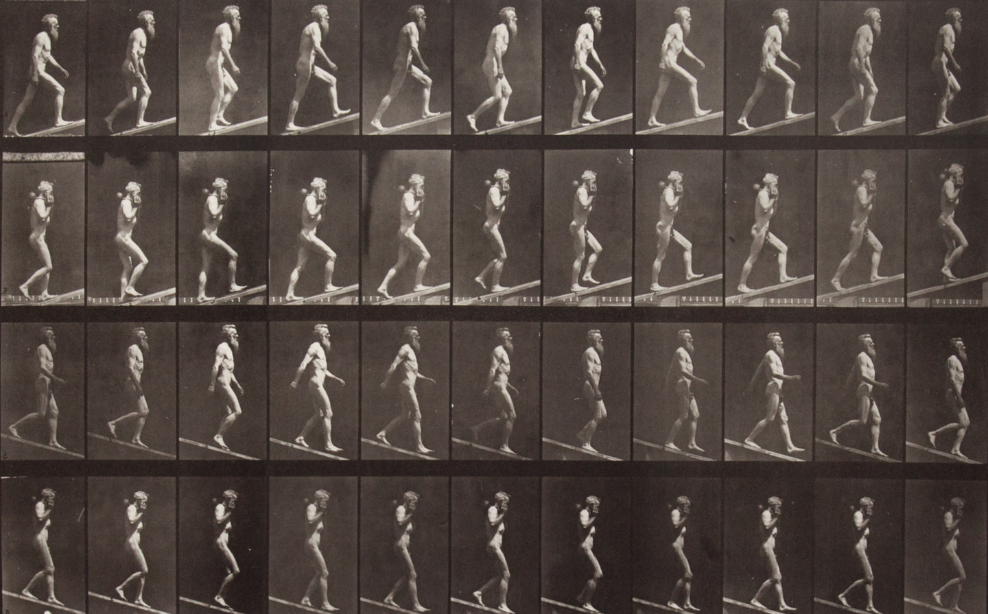 Sepia toned photograph with a grid of 44 panels showing a nude man walking on an incline. 12 panels show ascending motion; 12 show ascending motion carrying a dumbbell; 12 show descending motion; 12 show descending motion with a dumbbell.