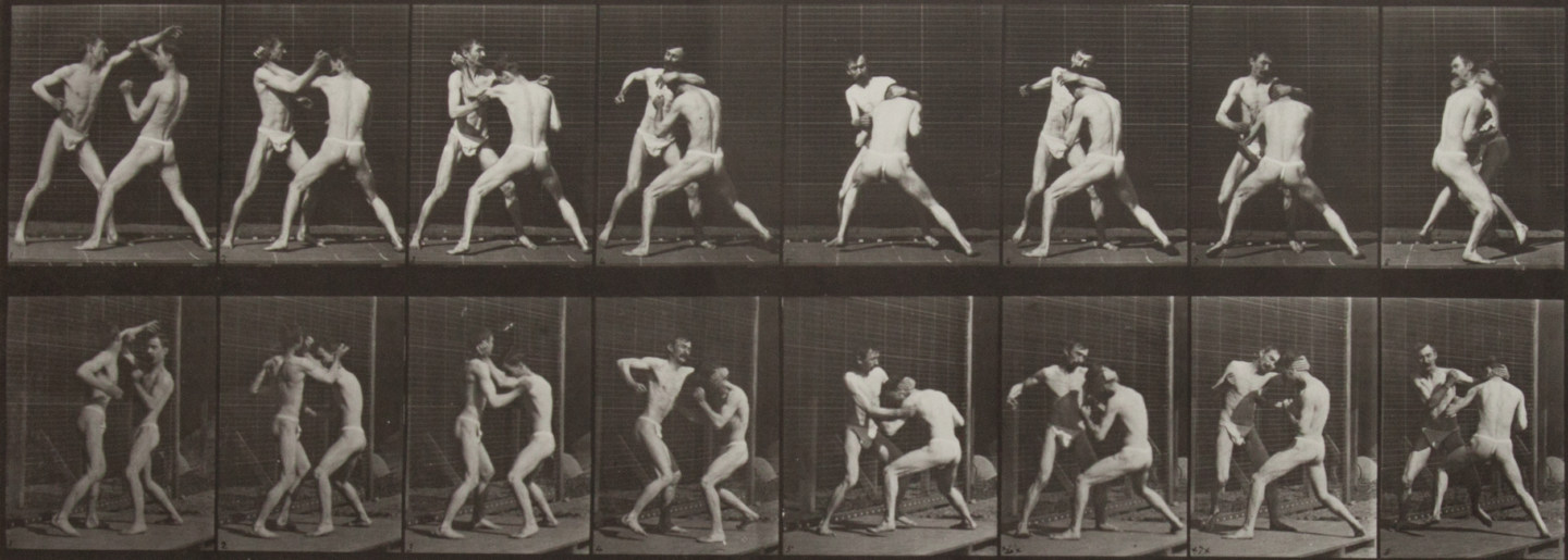 Sepia toned photograph with a grid of 16 panels showing two men in loin cloths boxing.
