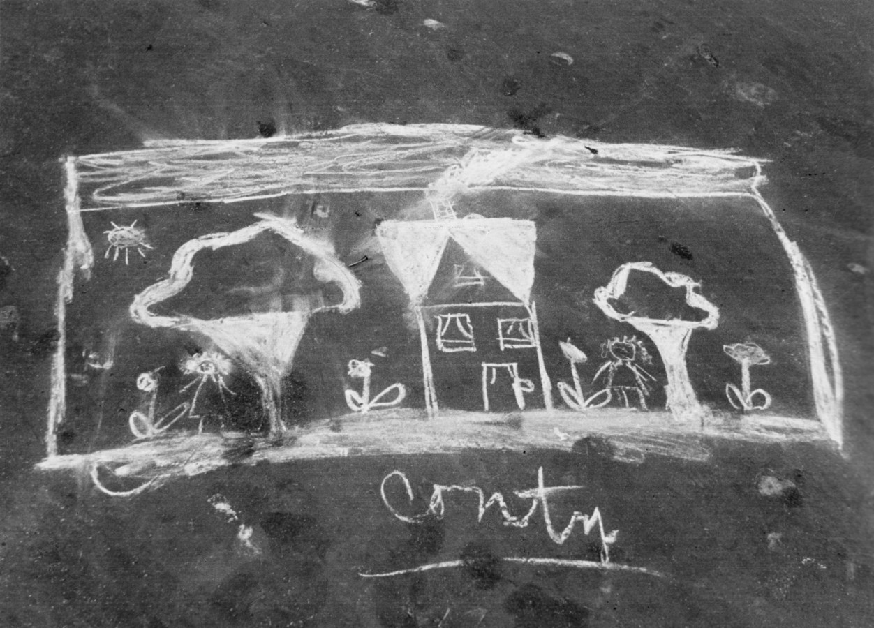 Black-and-white photograph of a chalk drawing of a house and two trees, captioned "Contry."