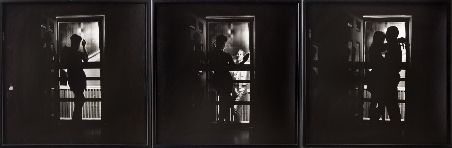Three framed black and white photographs. In the first, an African American woman stands silhouetted in a doorway; in the second, an African-American man appears outside of the door; in the third, the two embrace, silhouetted in the doorway.