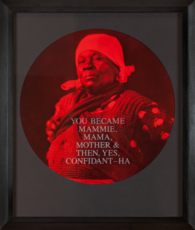 A circular photograph printed in red and black tones depict a woman framed in a black frame. Text printed across the woman reads "You Became Mammie, Mama, Mother, Then, Yes, Confidant-Ha."
