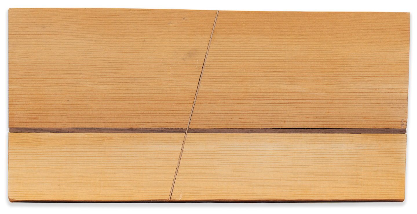 Horizontal wooden artwork with a horizontal and a slanted inlay down the middle of the board