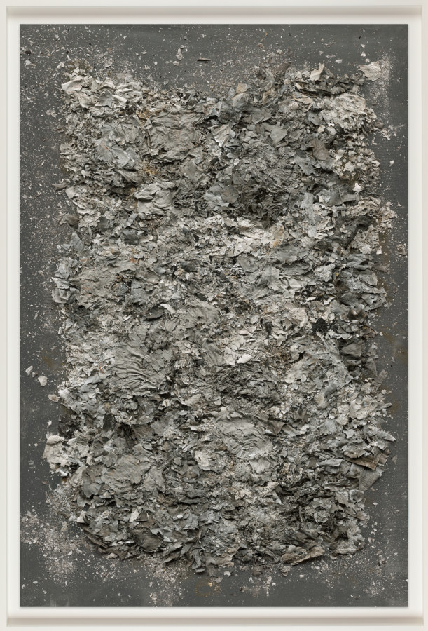 Color image of framed color photograph depicting a form made of ashes