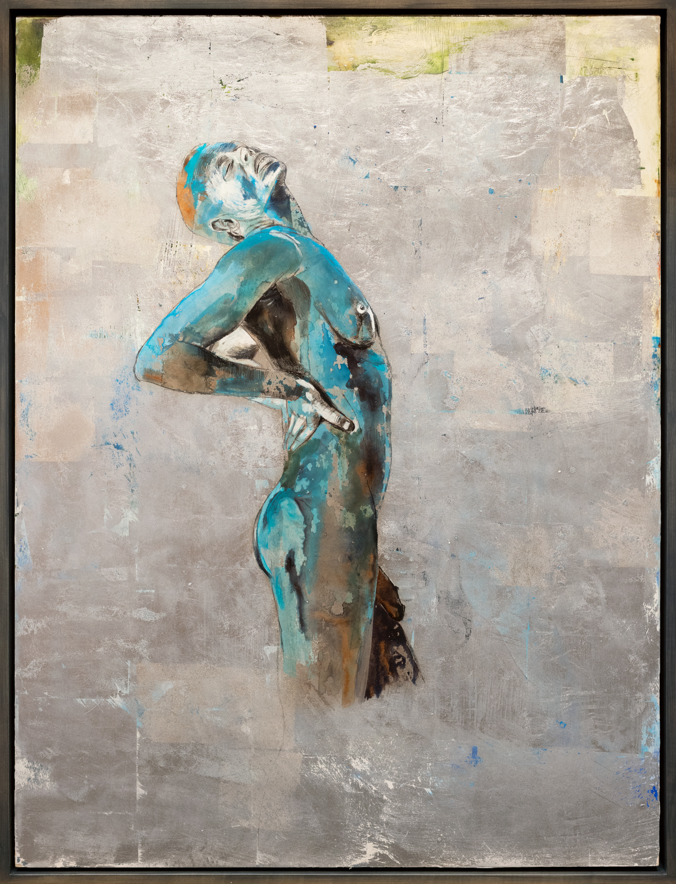 Color image of a mixed media artwork of a nude figure standing with silver background framed in grey frame