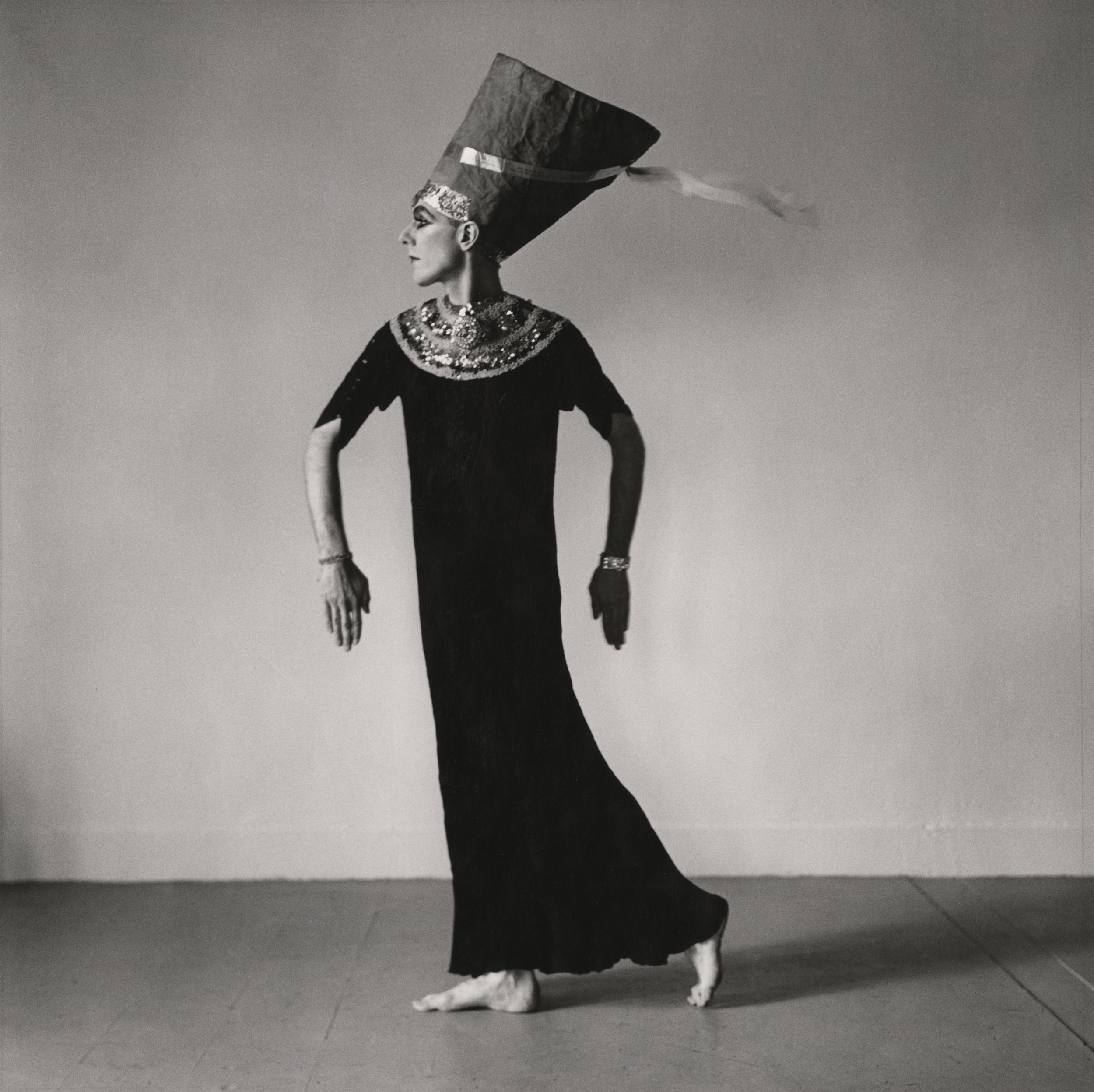 Black and white photograph of female impersonator in costume as Nefertiti