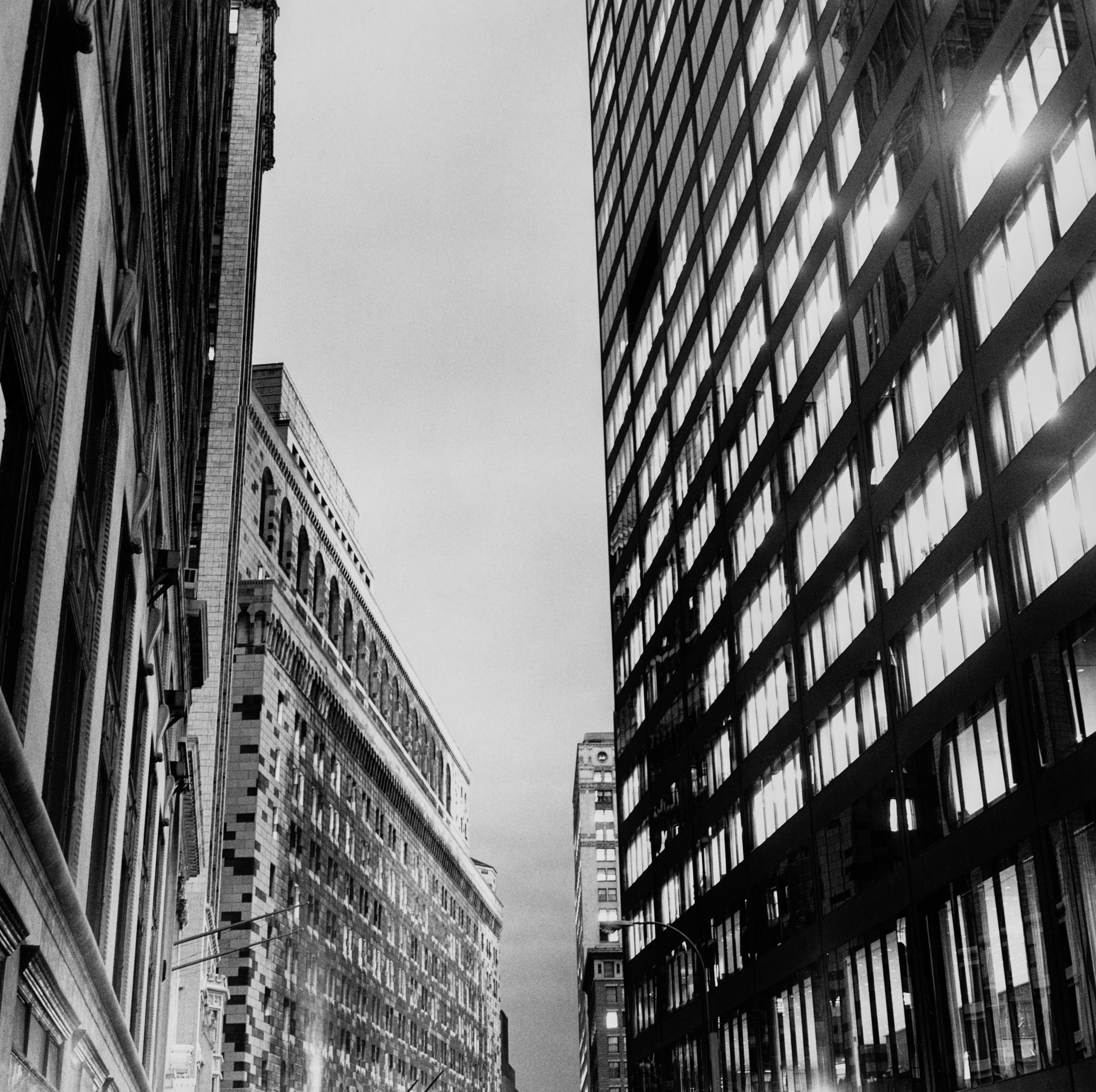 Black and white photograph of buildings in New York shot from the street